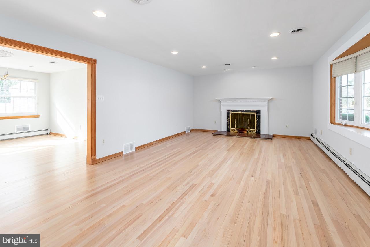 901 Pennsylvania Avenue Cherry Hill, NJ 08002 - Photo 4 of 20 wooden floor in an empty room with a window