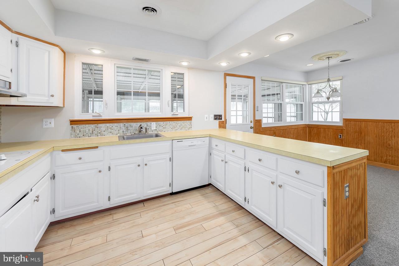 901 Pennsylvania Avenue Cherry Hill, NJ 08002 - Photo 9 of 20 a large white kitchen with a large window