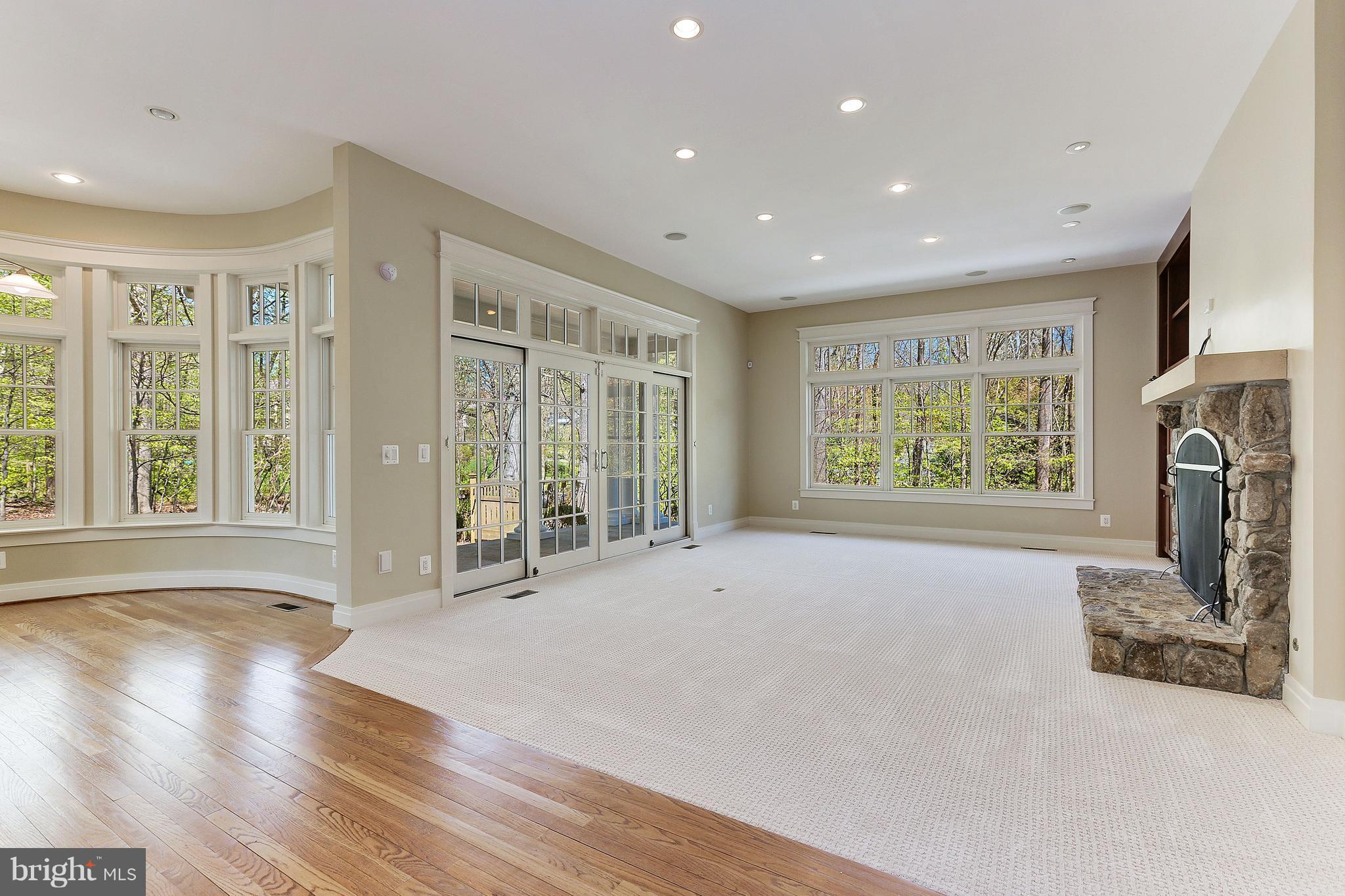 8610 Fernwood Road Bethesda, MD 20817 - Photo 11 of 30 a view of an empty room with wooden floor and a window