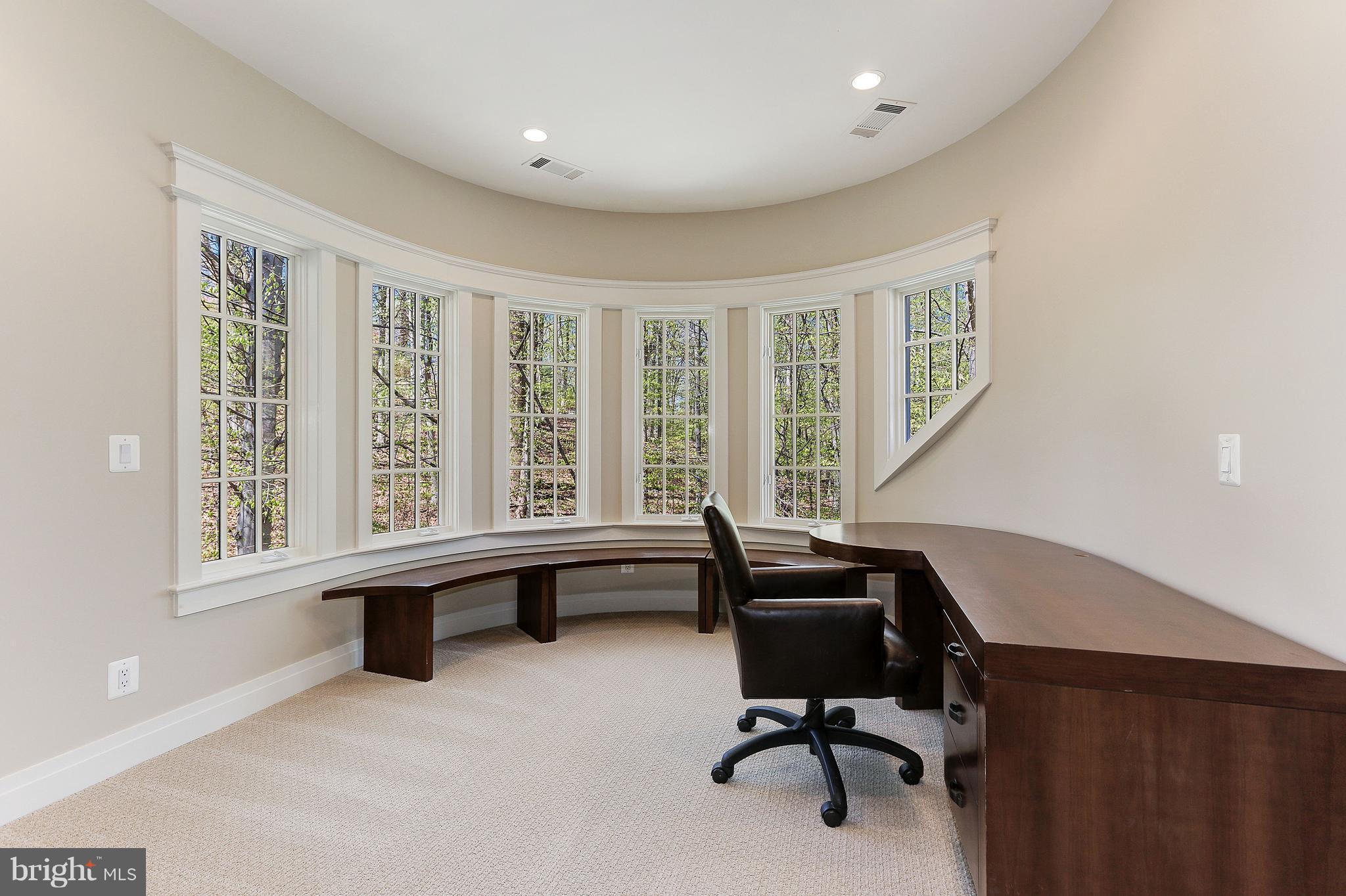 8610 Fernwood Road Bethesda, MD 20817 - Photo 16 of 30 a view of a workspace with furniture and a window