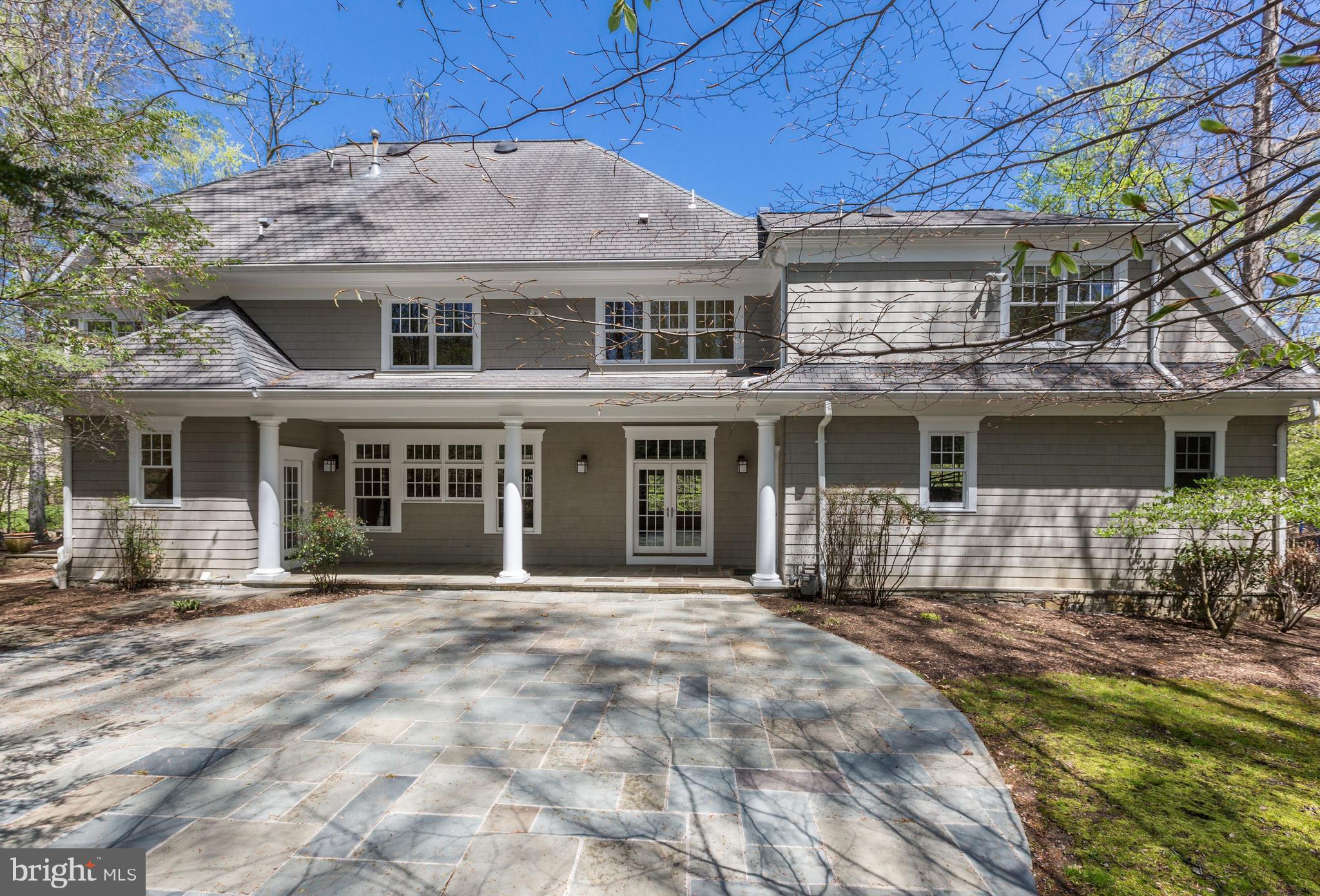 8610 Fernwood Road Bethesda, MD 20817 - Photo 28 of 30 a front view of a house with a garden