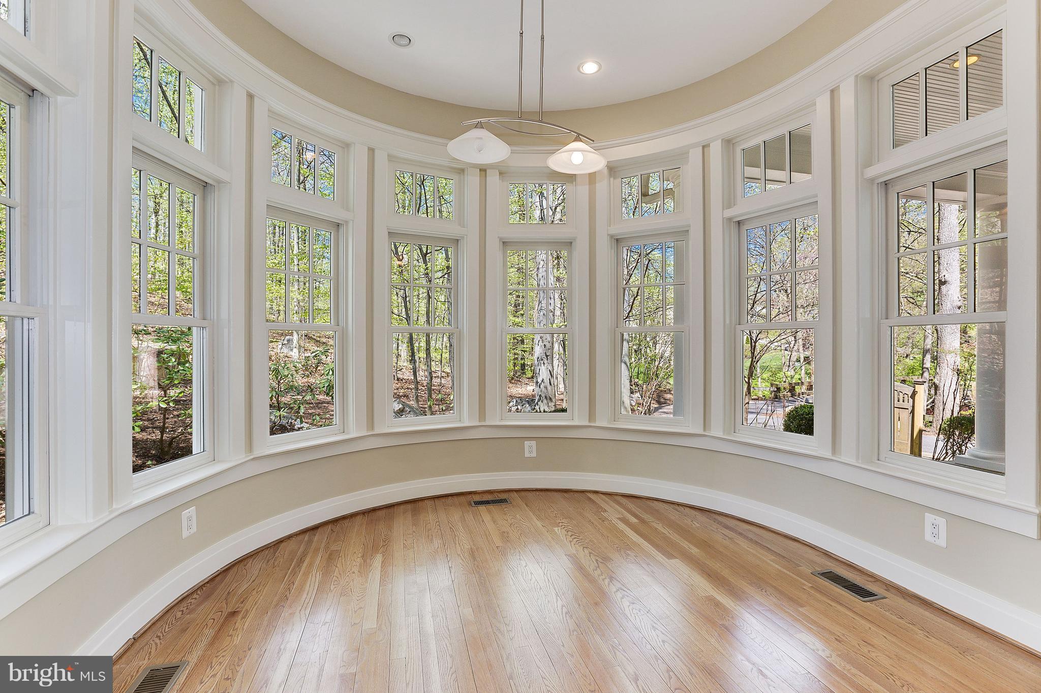 8610 Fernwood Road Bethesda, MD 20817 - Photo 10 of 30 a view of an empty room with a window and wooden floor