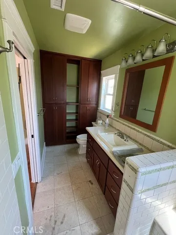 a bathroom with a sink a mirror and a shower