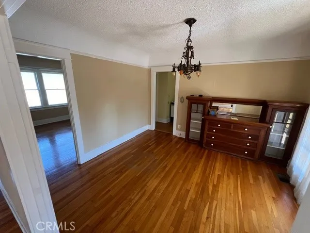 a view of livingroom with hardwood floor and a ceiling fan