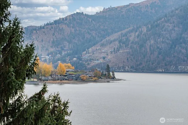 a view of swimming pool outdoor seating and city view