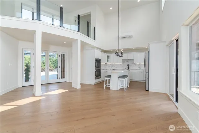 a spacious bedroom with a large bed and a window