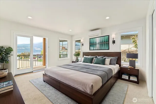 a view of a hallway with wooden floor windows and a kitchen
