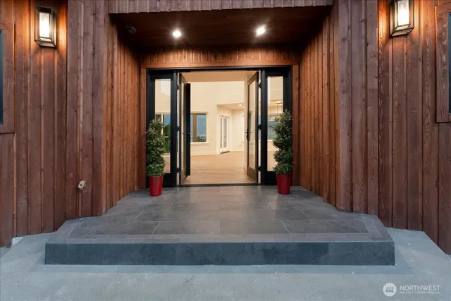 a kitchen with kitchen island a sink stove and refrigerator