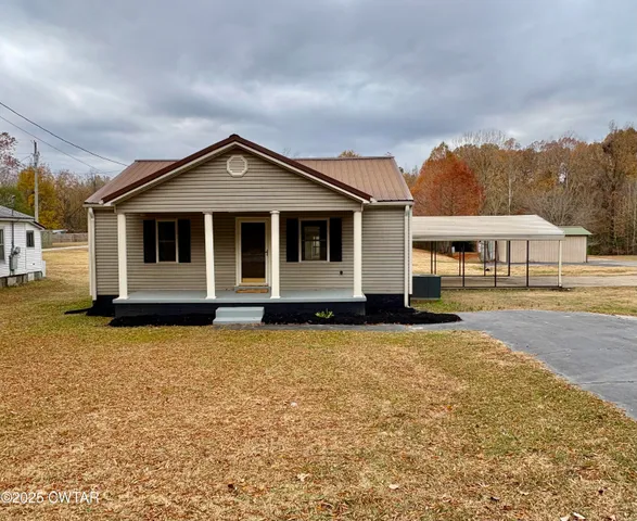 a front view of a house with yard