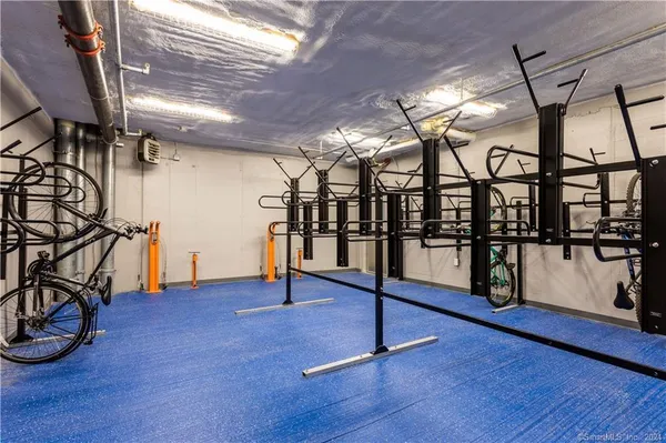 a view of a hallway view with wooden floor and furniture
