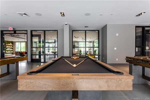 a kitchen with a sink a counter top space and stainless steel appliances