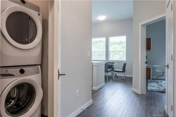 a bedroom with double bed and a large window