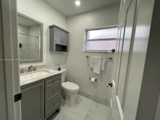 600 Southeast 25th Lane Homestead, FL 33033 - Photo 11 of 25 a bathroom with a toilet sink and mirror