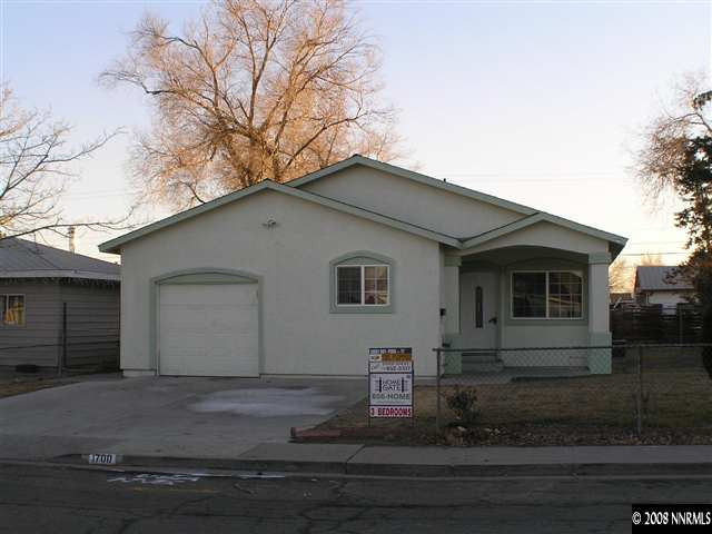1700 Haddock Drive Reno, NV 89512 - Photo 1 of 3 a house that has a tree in front of it