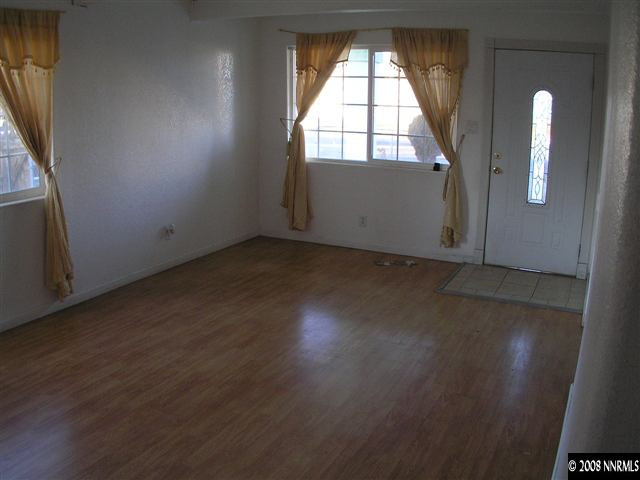 1700 Haddock Drive Reno, NV 89512 - Photo 3 of 3 an empty room with wooden floor and windows