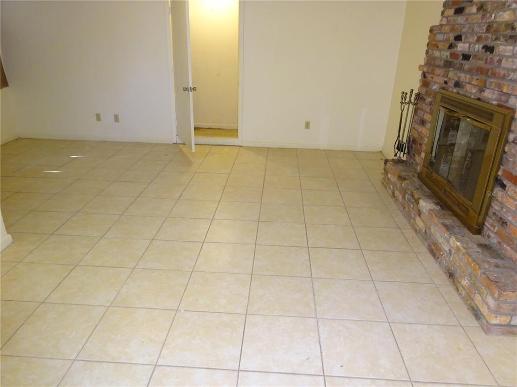 217 Northwest 36th Drive Gainesville, FL 32607 - Photo 8 of 16 a view of an empty room with a sink and a mirror