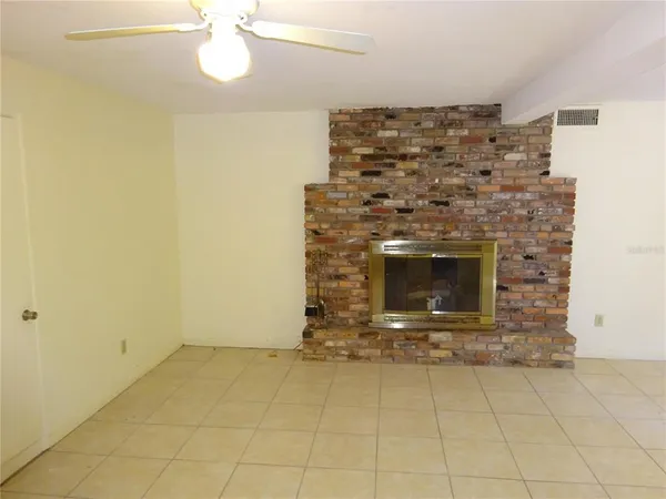 an empty room with a fireplace