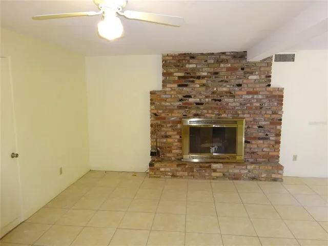 an empty room with a fireplace