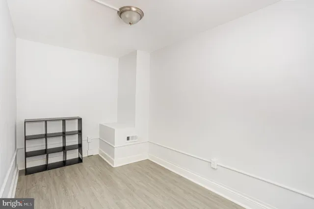 a view of a backyard with wooden fence