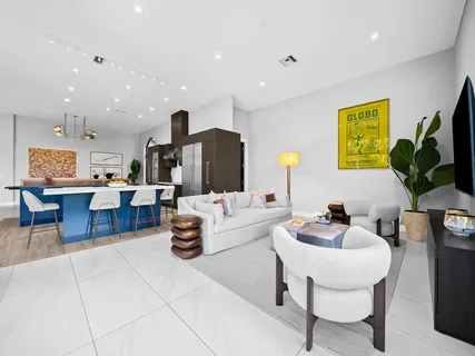 a kitchen with stainless steel appliances granite countertop a stove and a refrigerator