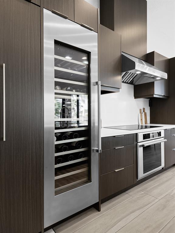 2583 Mayfair Lane Weston, FL 33327 - Photo 28 of 61 a kitchen with stainless steel appliances granite countertop a stove and a refrigerator