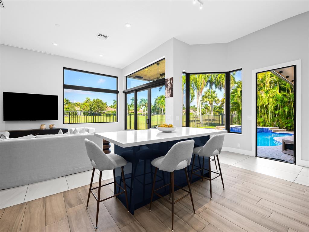 2583 Mayfair Lane Weston, FL 33327 - Photo 31 of 61 a view of a dining room with furniture window and wooden floor