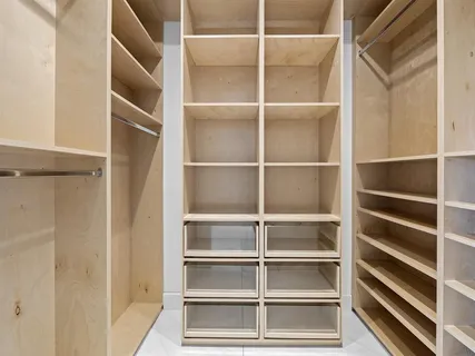 a bedroom with a bed and a desk