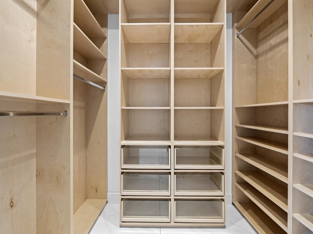 2583 Mayfair Lane Weston, FL 33327 - Photo 37 of 61 a view of walk in closet with empty racks