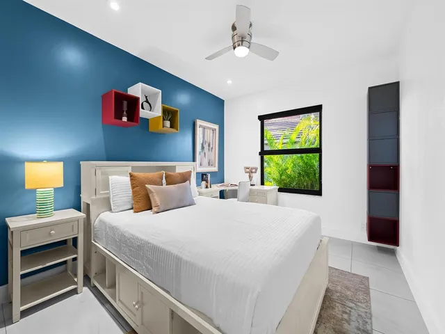 a view of room with window and ceiling fan