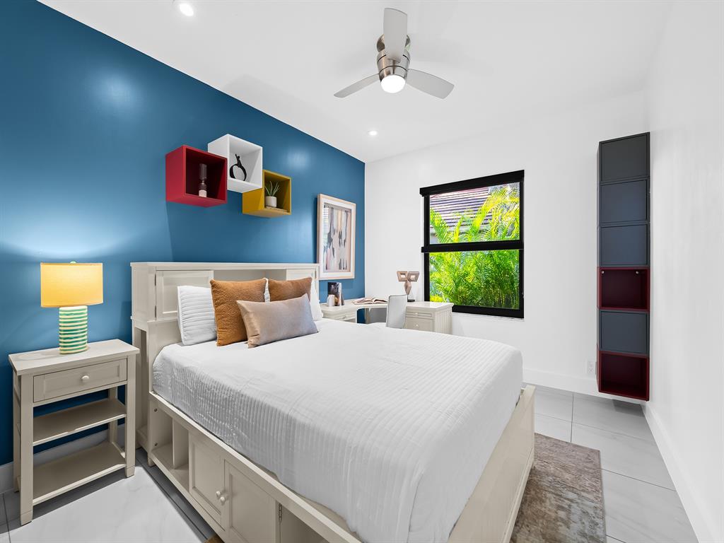 2583 Mayfair Lane Weston, FL 33327 - Photo 40 of 61 a bedroom with a bed and a window