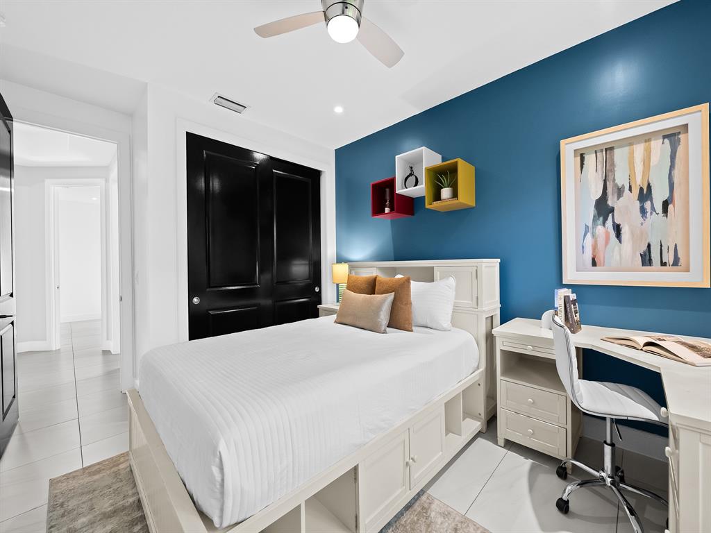 2583 Mayfair Lane Weston, FL 33327 - Photo 41 of 61 a bedroom with a bed and a desk