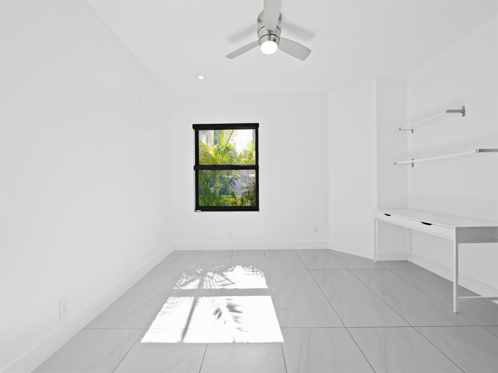 2583 Mayfair Lane Weston, FL 33327 - Photo 44 of 61 an empty room with windows and fan