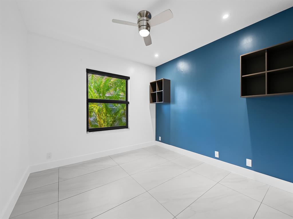 2583 Mayfair Lane Weston, FL 33327 - Photo 47 of 61 a view of room with window and ceiling fan