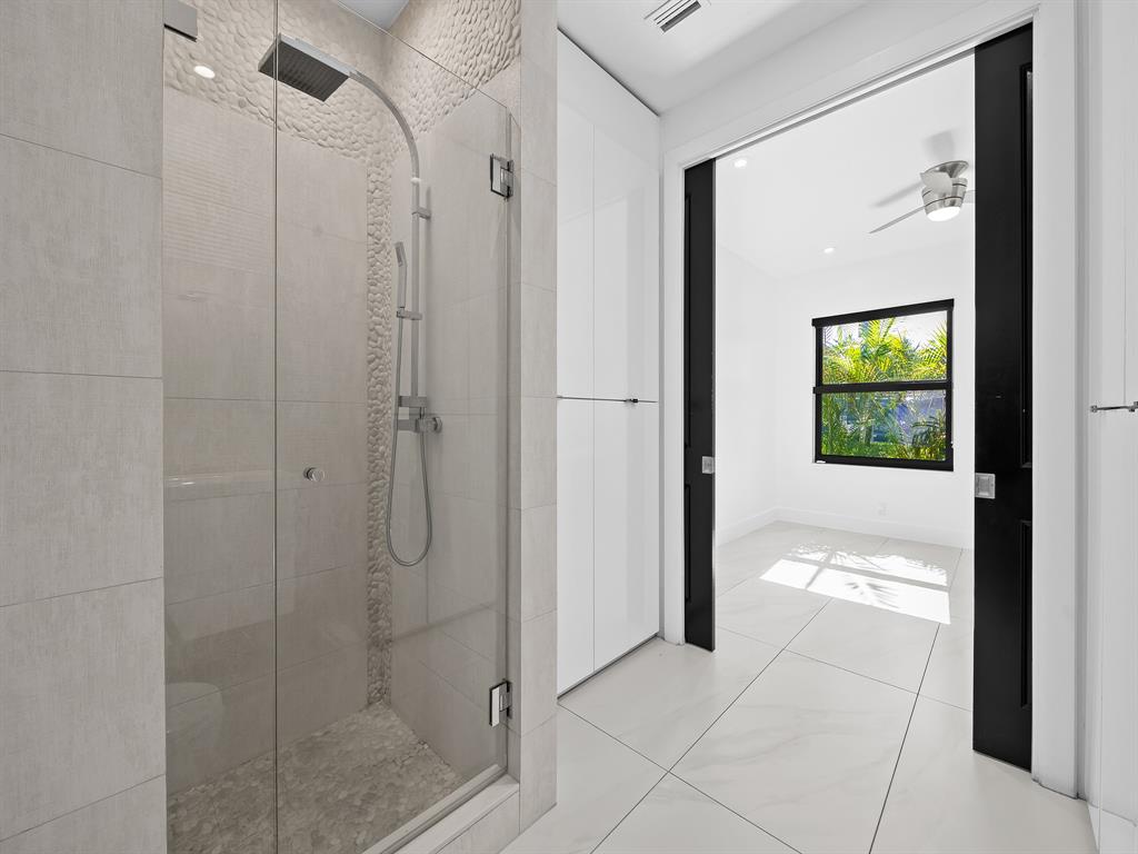 2583 Mayfair Lane Weston, FL 33327 - Photo 50 of 61 a bathroom with a shower and a sink