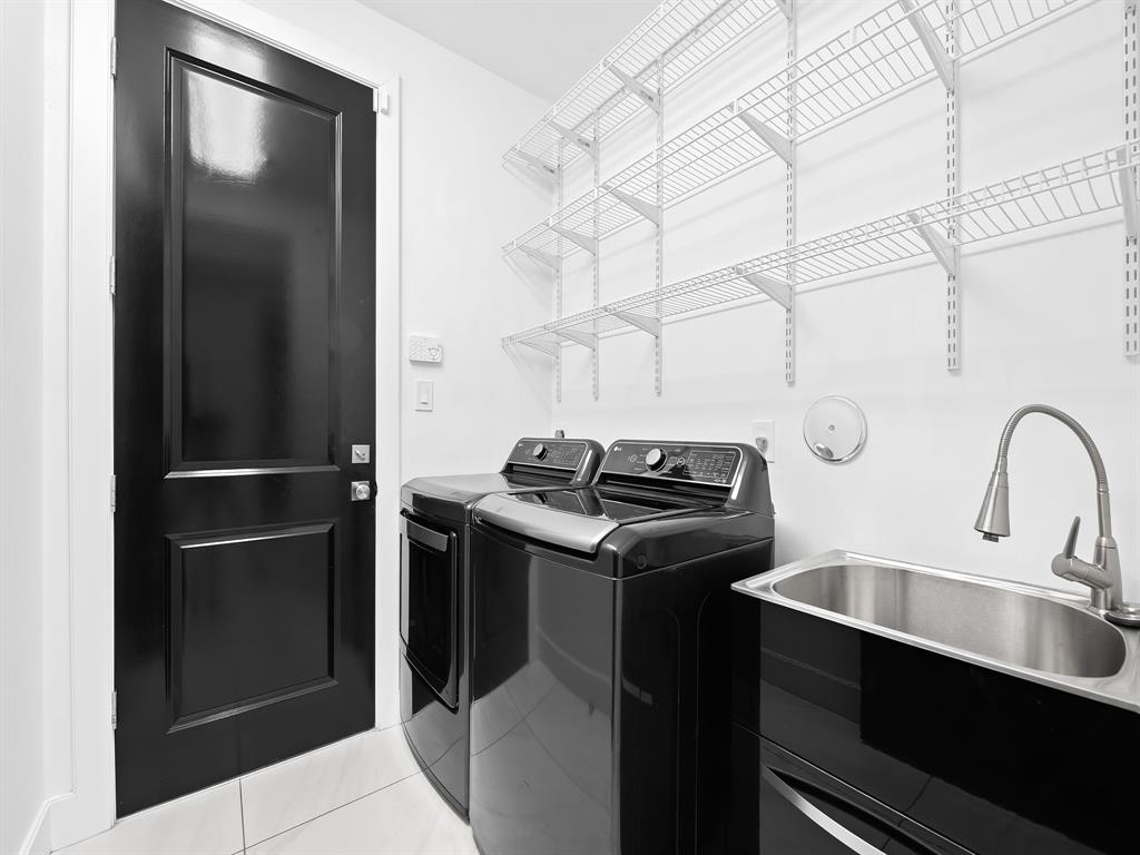 2583 Mayfair Lane Weston, FL 33327 - Photo 51 of 61 a kitchen with a sink and stainless steel appliances