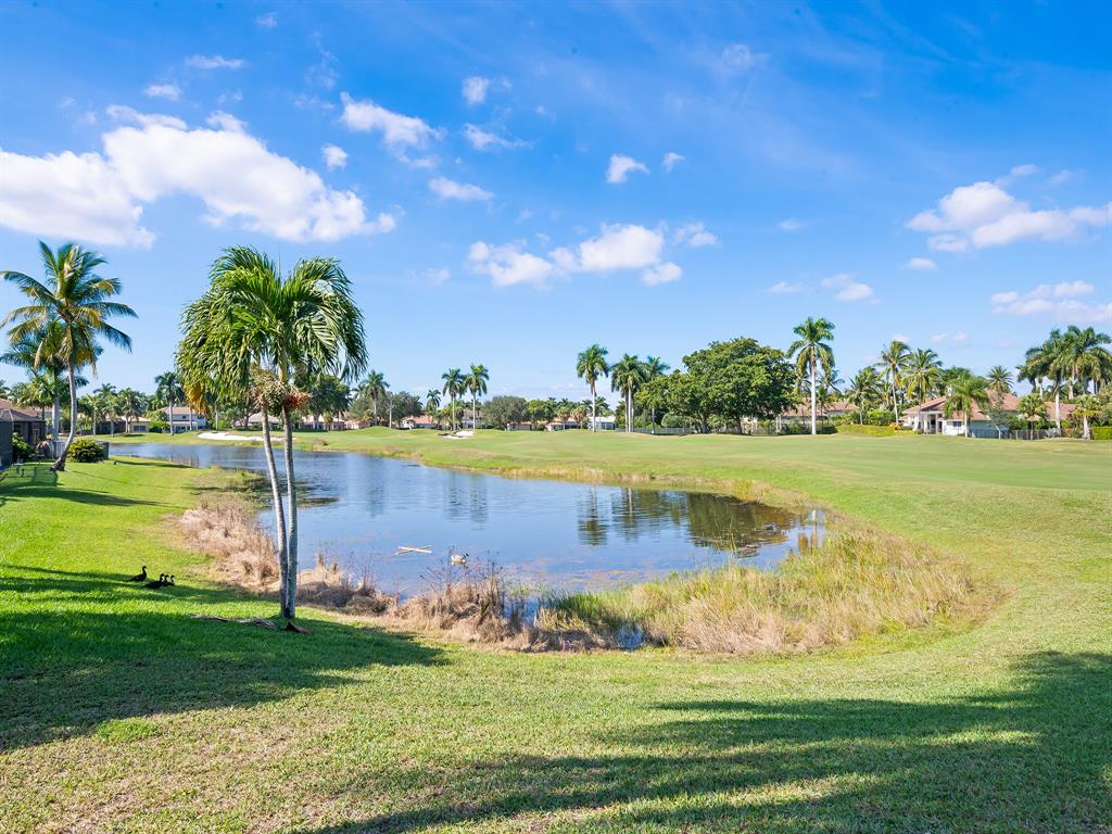2583 Mayfair Lane Weston, FL 33327 - Photo 60 of 61 a view of a lake with a big yard