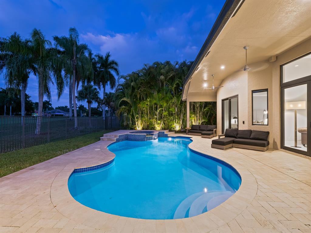 2583 Mayfair Lane Weston, FL 33327 - Photo 7 of 61 a view of a swimming pool with chairs