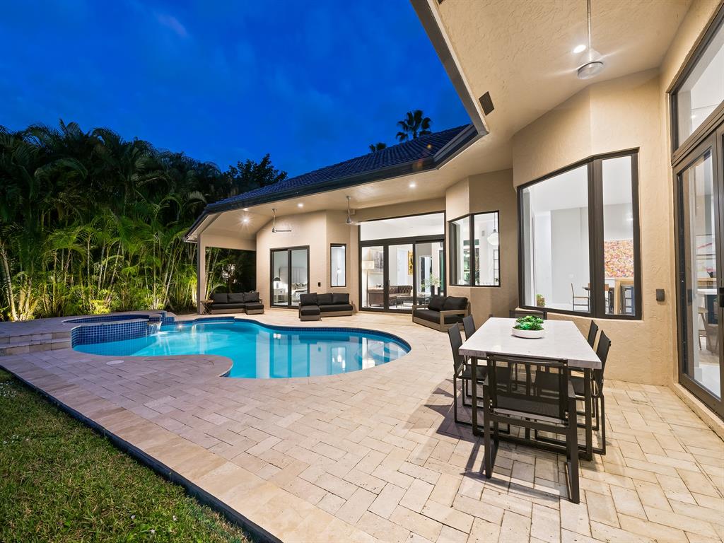 2583 Mayfair Lane Weston, FL 33327 - Photo 8 of 61 a view of a patio with swimming pool table and chairs