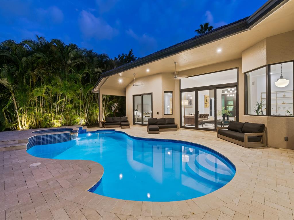 2583 Mayfair Lane Weston, FL 33327 - Photo 9 of 61 a view of a house with swimming pool and porch