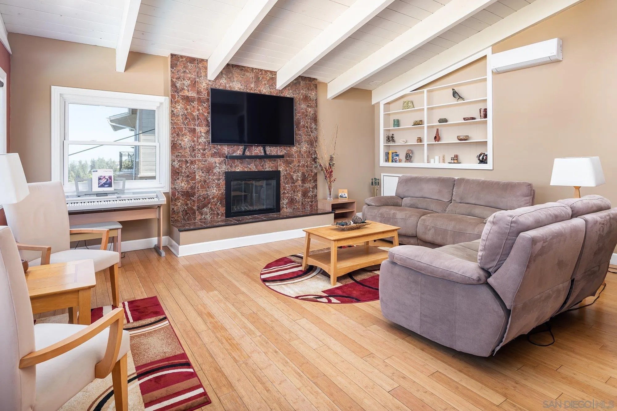 4361 Valle Drive La Mesa, CA 91941 - Photo 13 of 67 a living room with furniture a flat screen tv and a fireplace