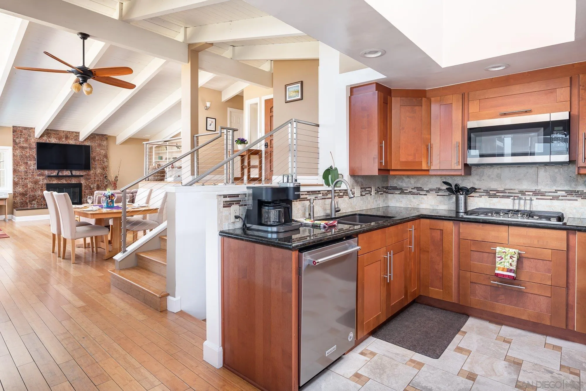 4361 Valle Drive La Mesa, CA 91941 - Photo 20 of 67 a kitchen with stainless steel appliances granite countertop a stove a sink and a microwave
