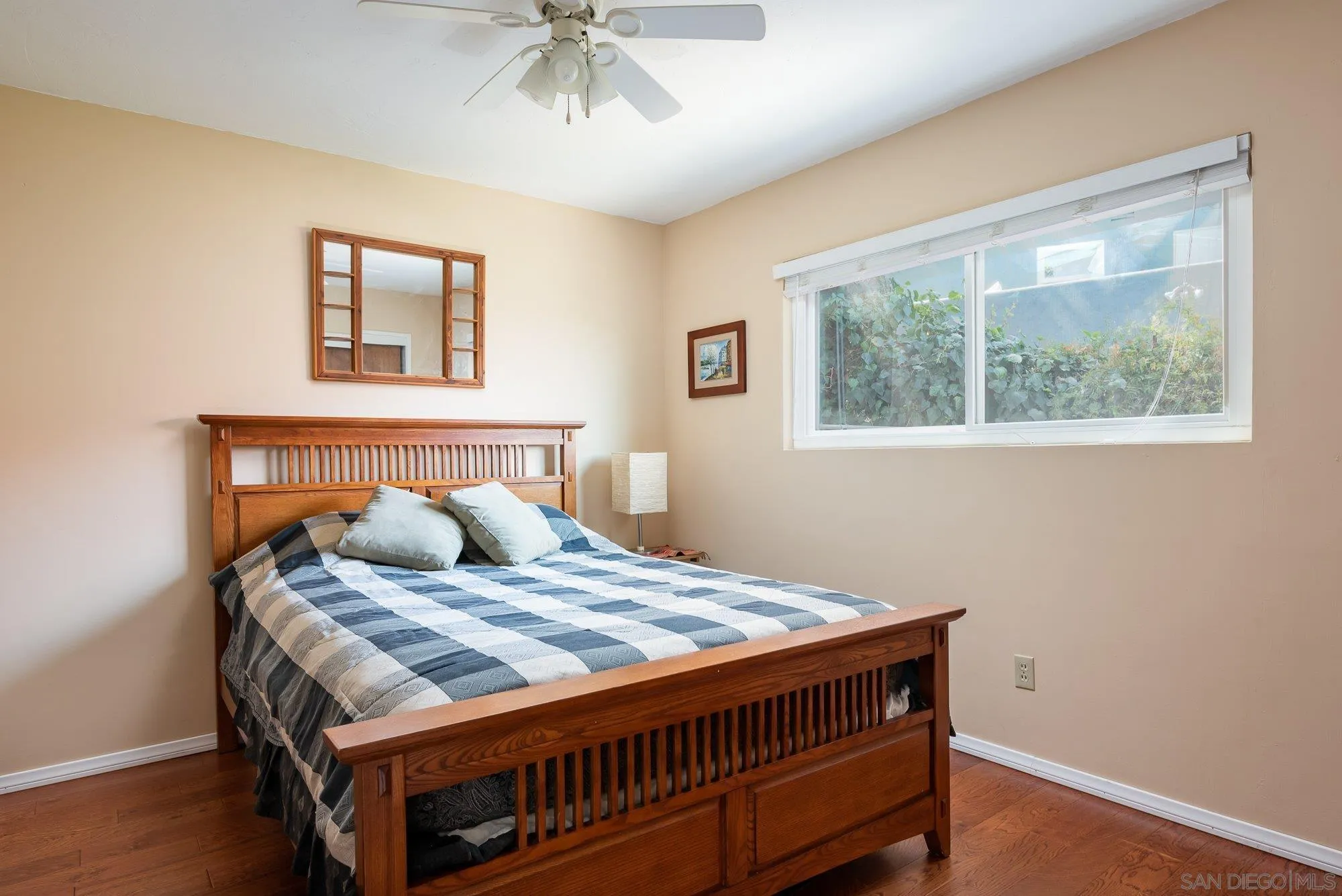 4361 Valle Drive La Mesa, CA 91941 - Photo 42 of 67 a bedroom with a bed and a window