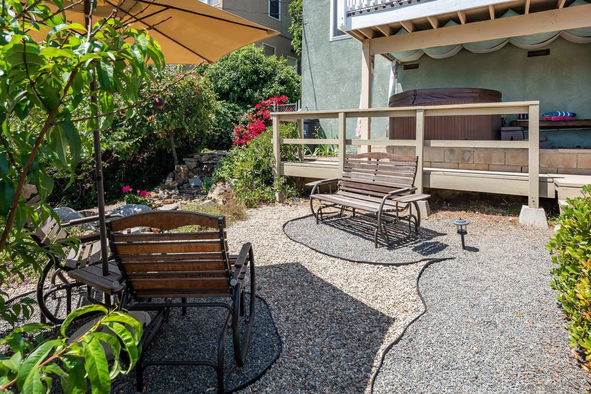 4361 Valle Drive La Mesa, CA 91941 - Photo 52 of 67 a backyard of a house with barbeque oven table and chairs