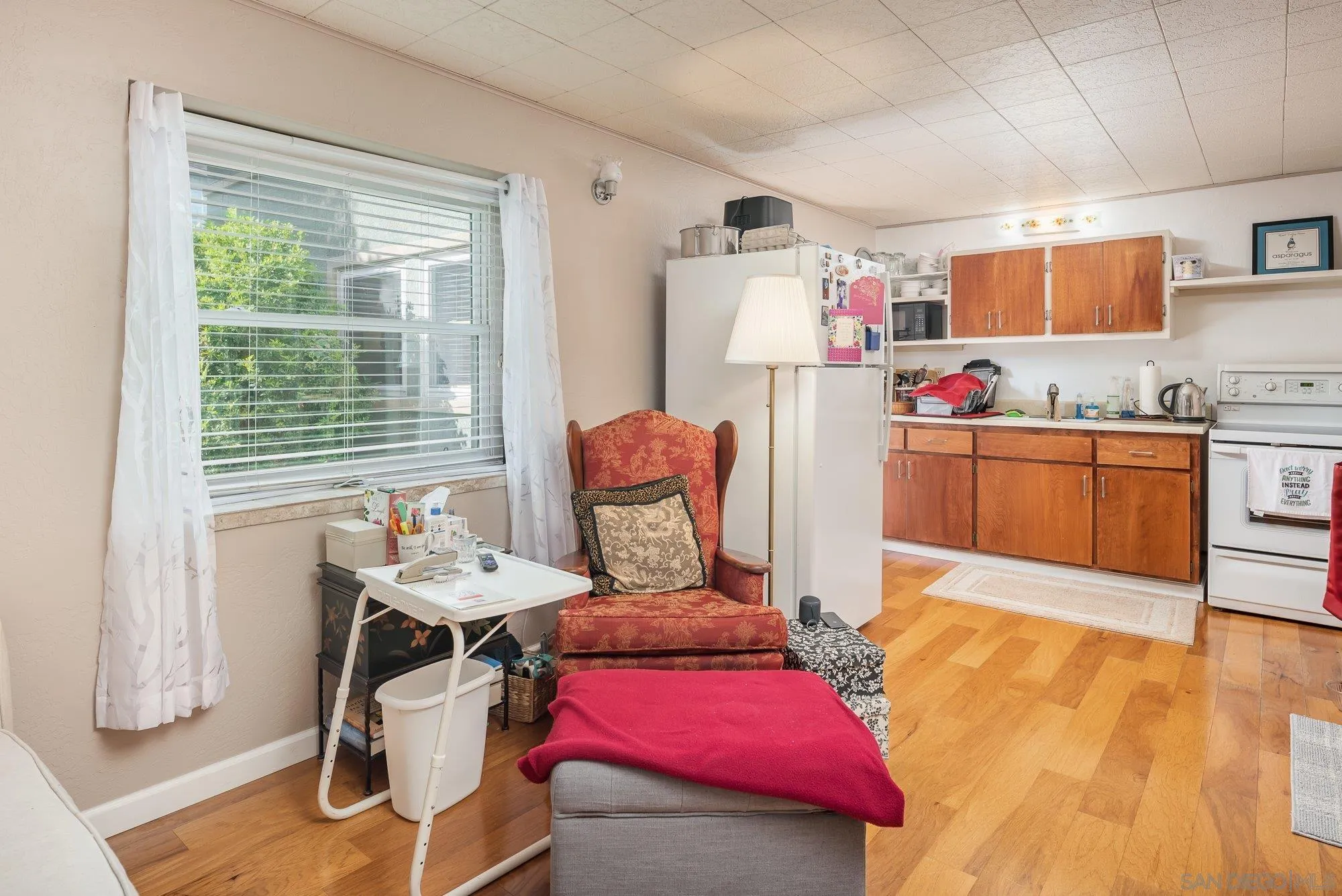 4361 Valle Drive La Mesa, CA 91941 - Photo 57 of 67 a kitchen with stainless steel appliances kitchen island granite countertop wooden cabinets and dining table