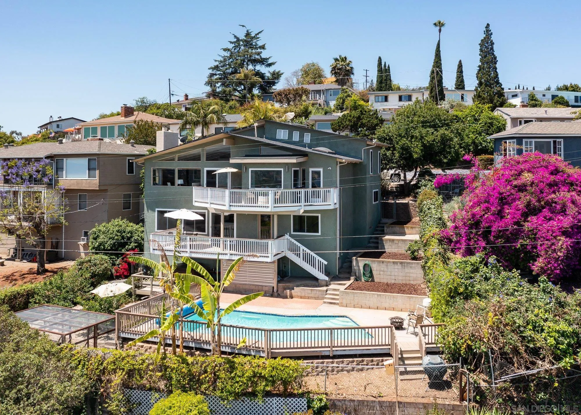 4361 Valle Drive La Mesa, CA 91941 - Photo 6 of 67 a front view of a house with a porch and a fountain