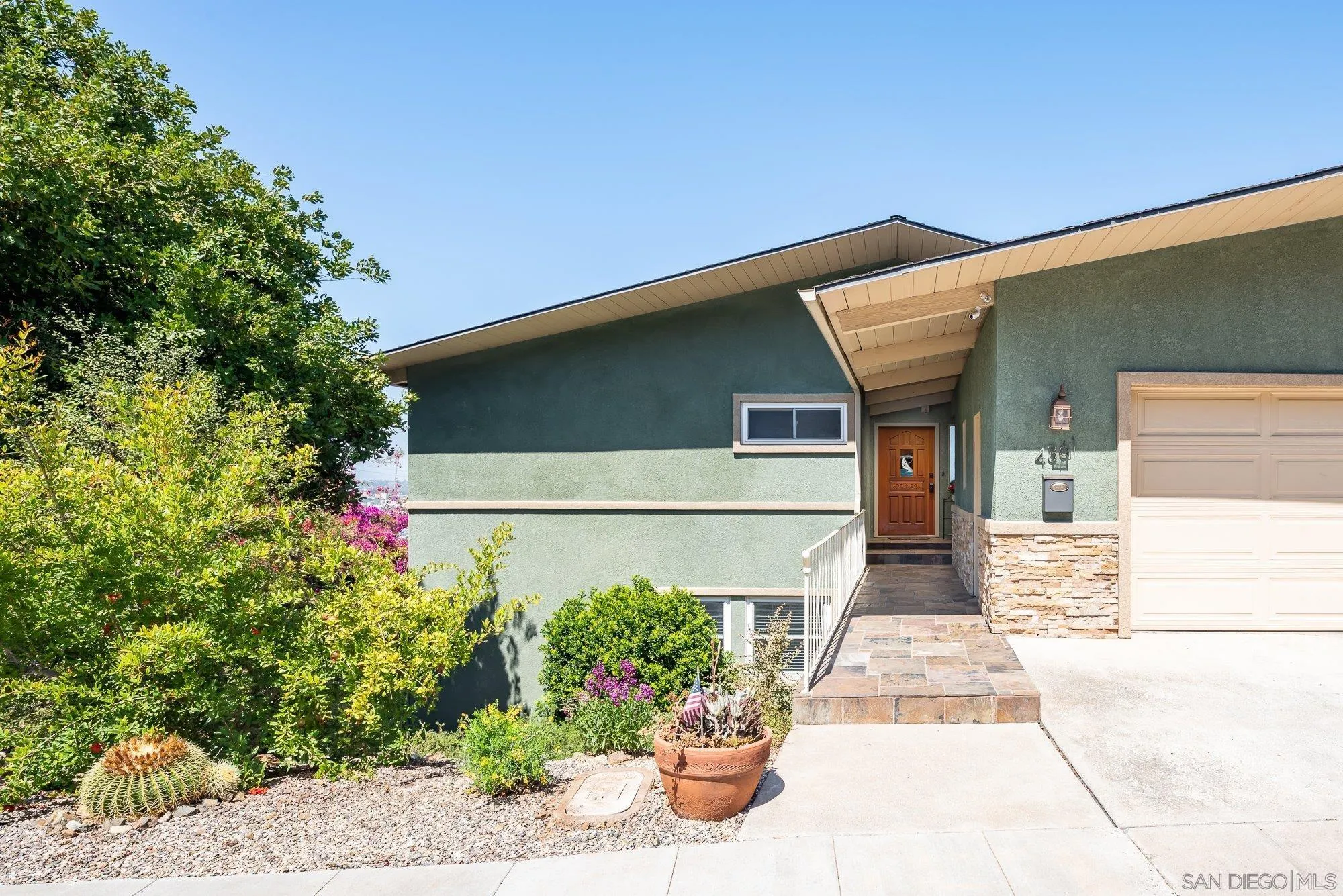 4361 Valle Drive La Mesa, CA 91941 - Photo 9 of 67 a front view of a house with plants