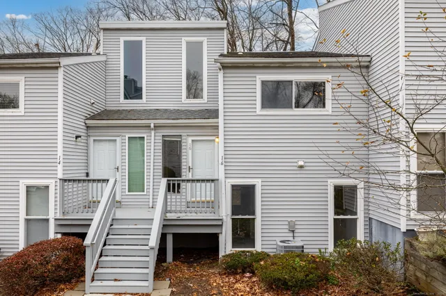 a front view of a house with stairs