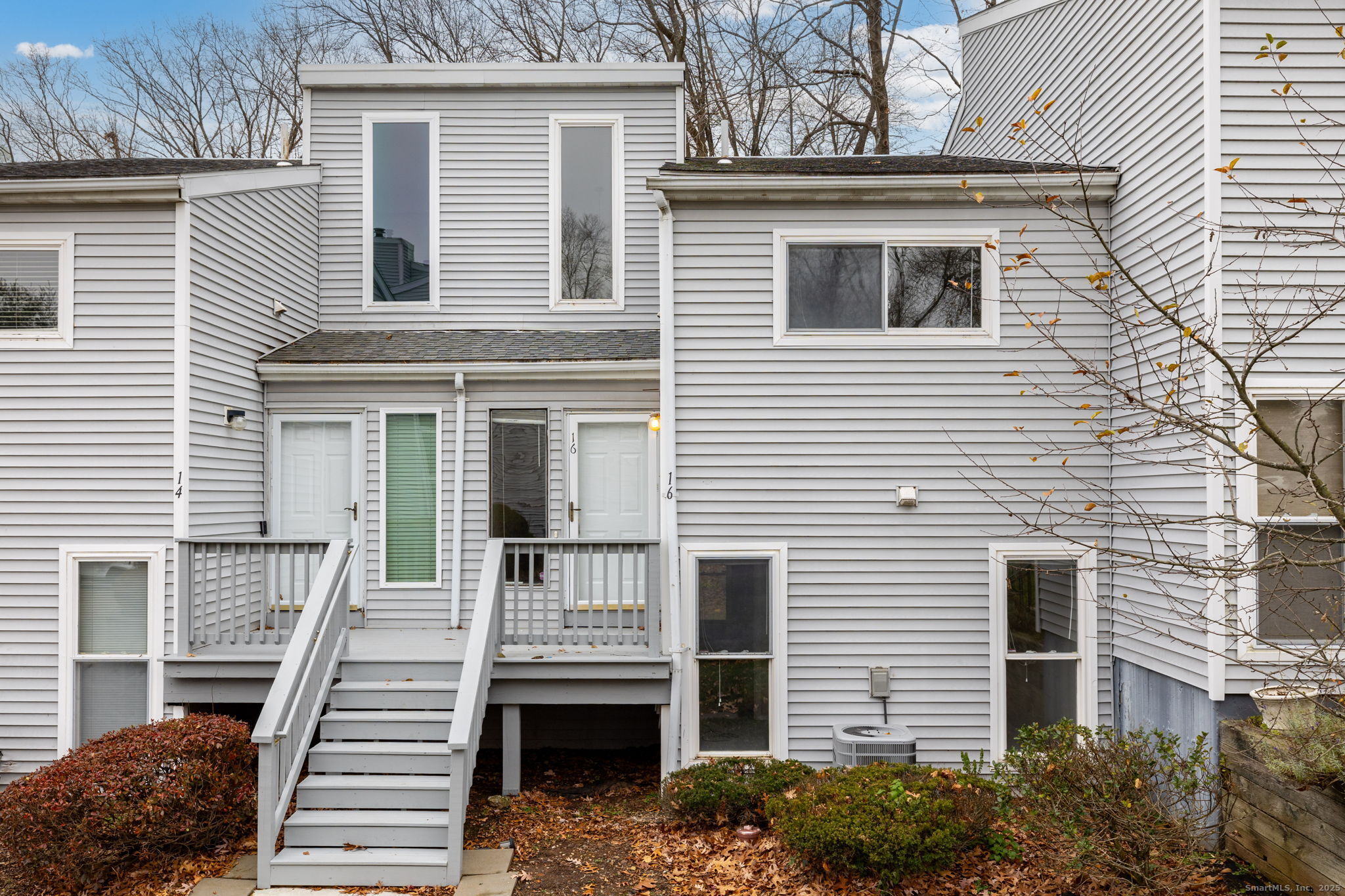 a front view of a house with stairs