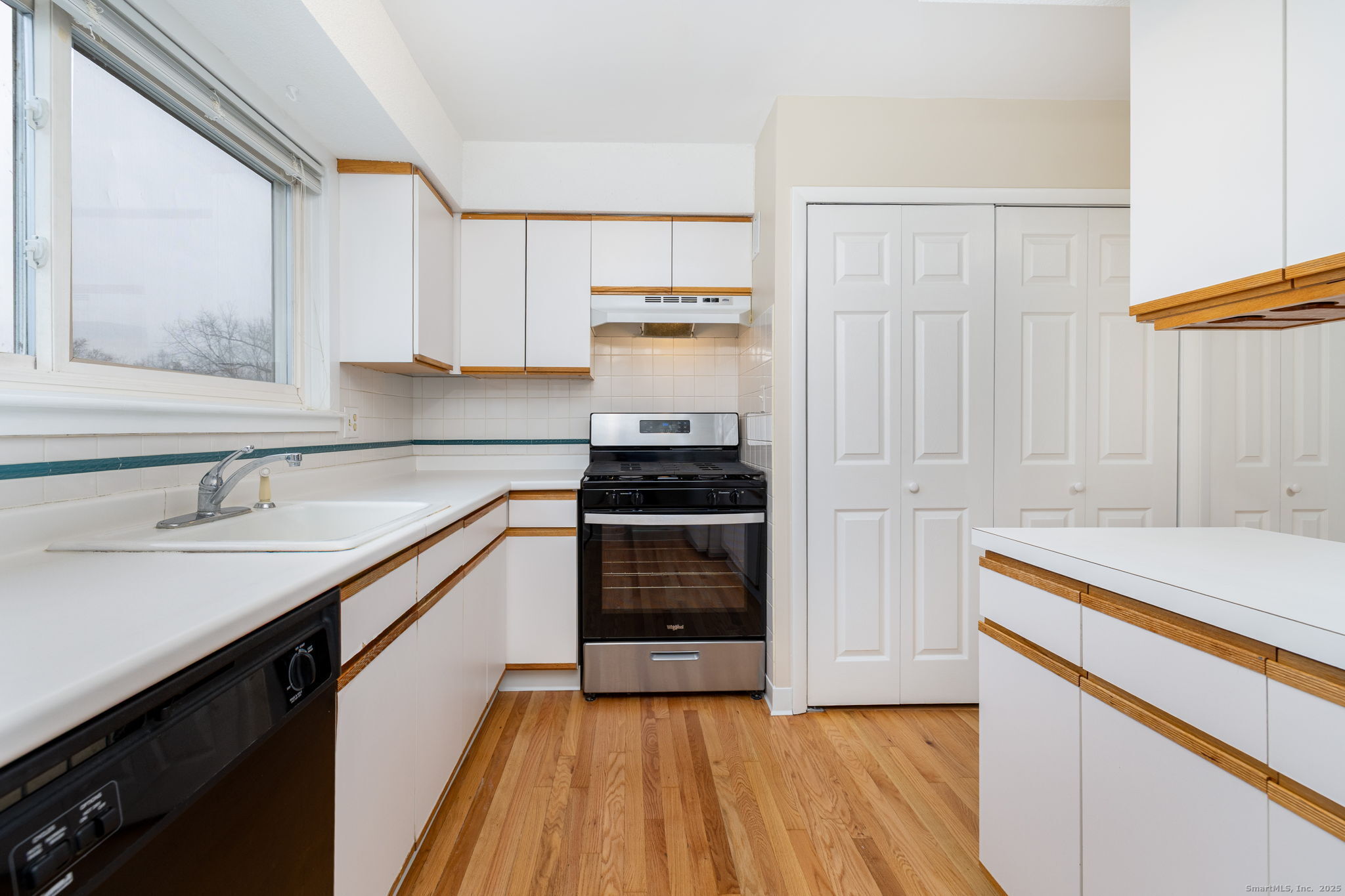 16 Springdale Road, Unit 16 Cromwell, CT 06416 - Photo 12 of 36 a kitchen with a sink stove and cabinets