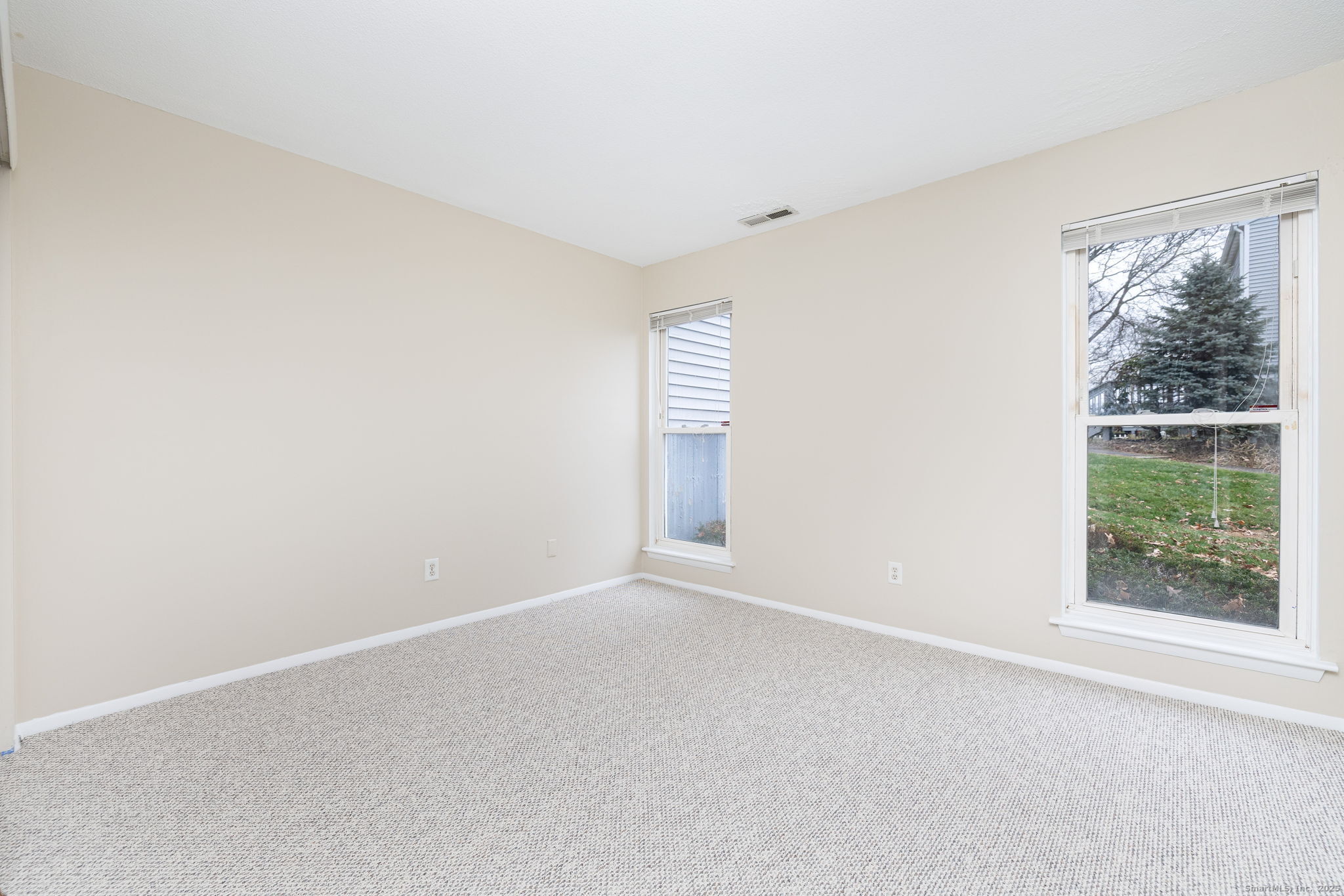 16 Springdale Road, Unit 16 Cromwell, CT 06416 - Photo 21 of 36 an empty room with windows